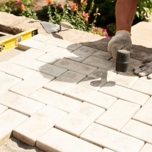 master-lays-paving-stones-layers-min